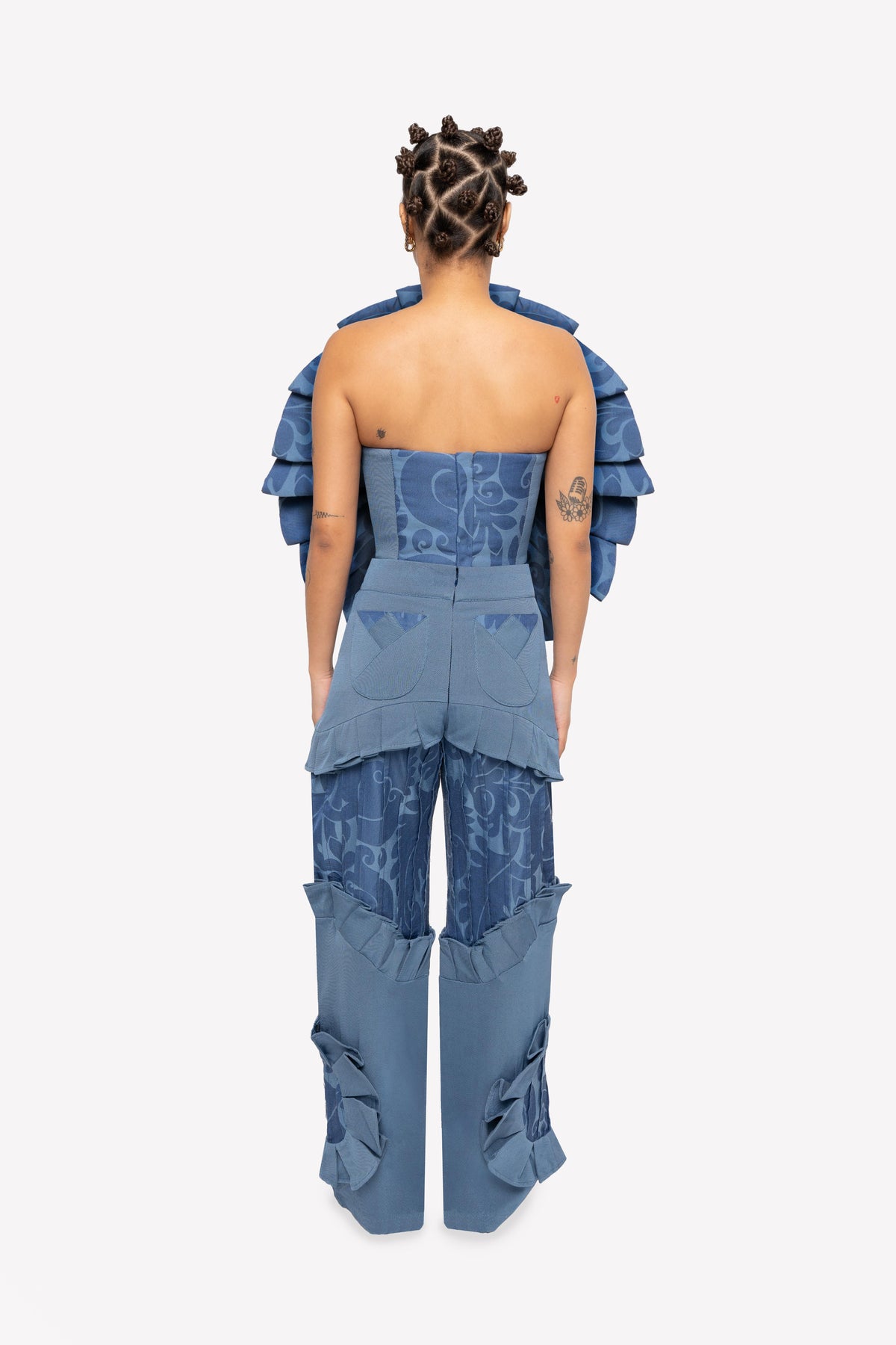Look: Sevda sculptural corset and Gracie high-waisted paneled pants – worn, back view